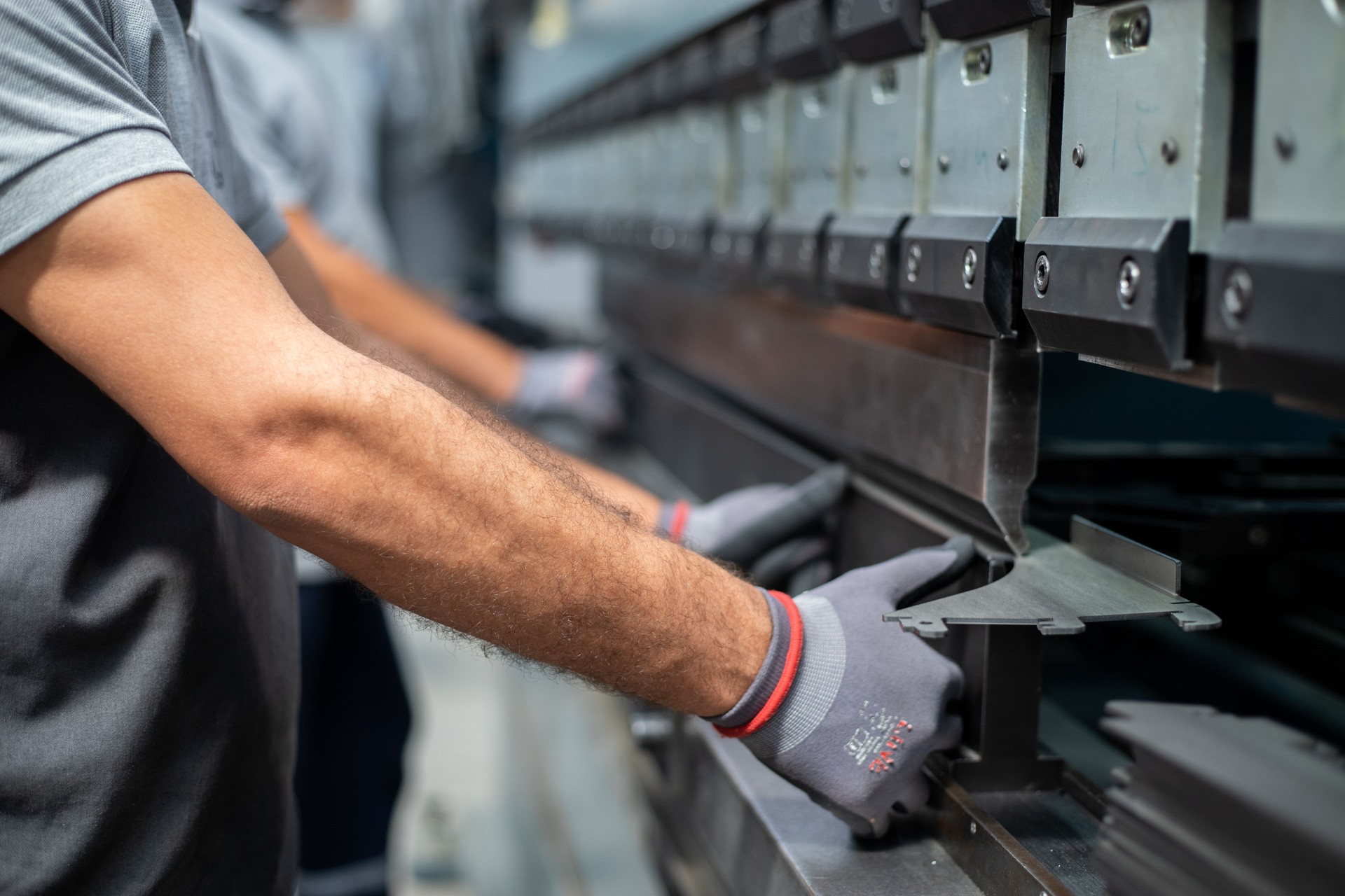 The technician operator working with press brake hydraulic bending machine. stock photo